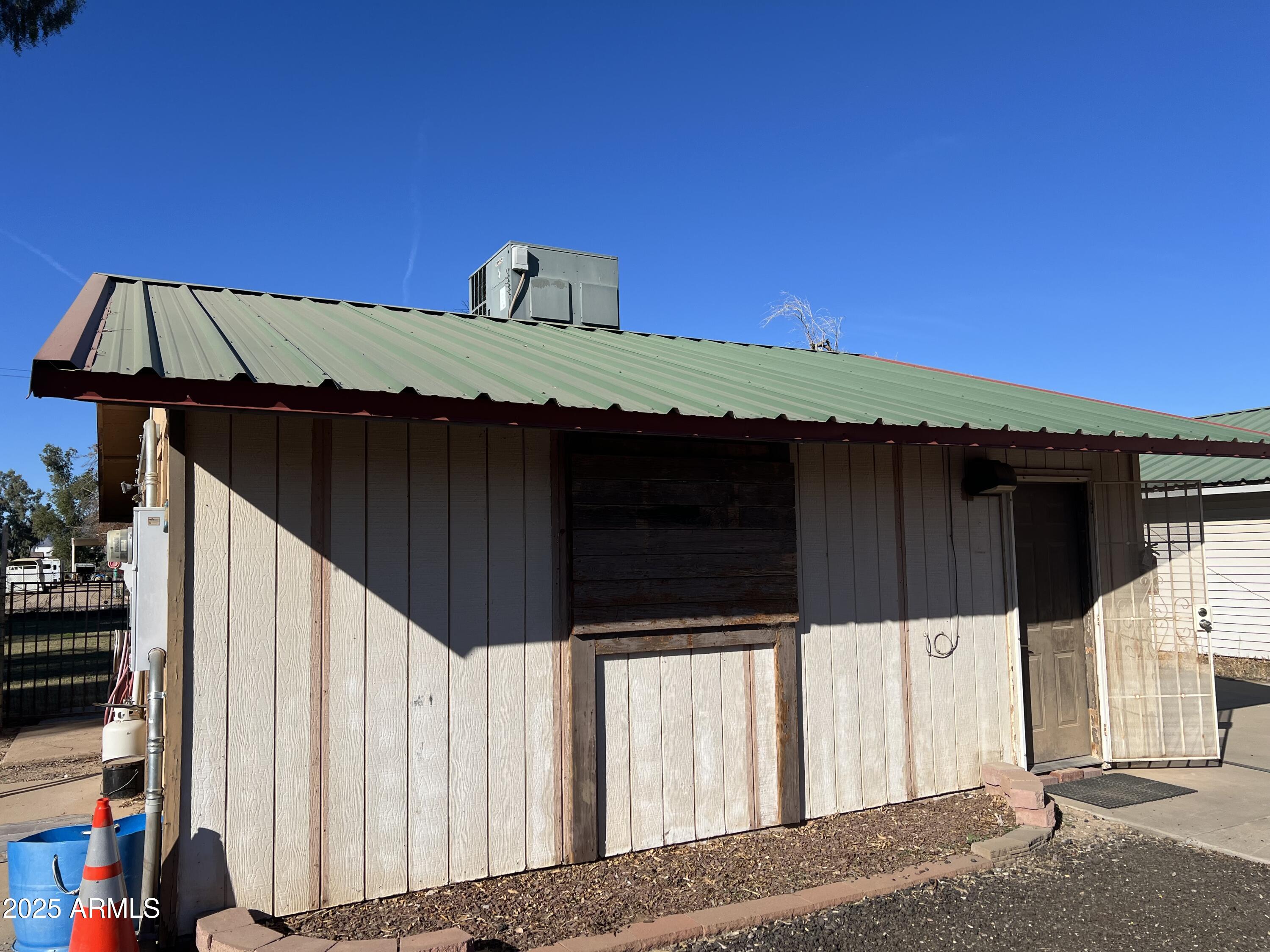 7431 North Alsup Road Litchfield Park, AZ 85340 - Photo 10 of 31 a view of a house with a wooden fence