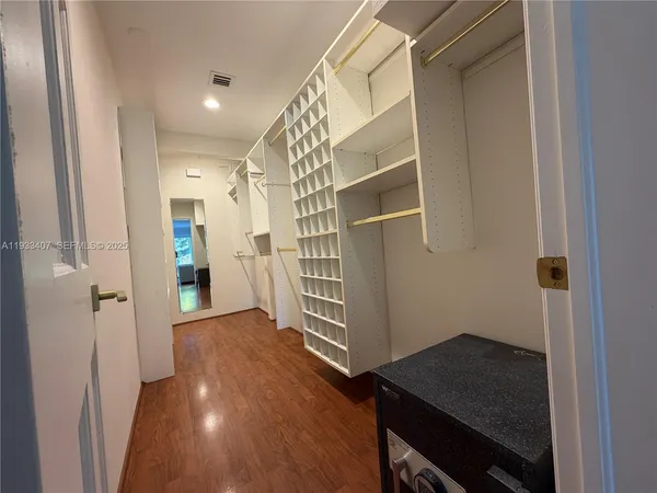 a view of entryway with wooden floor