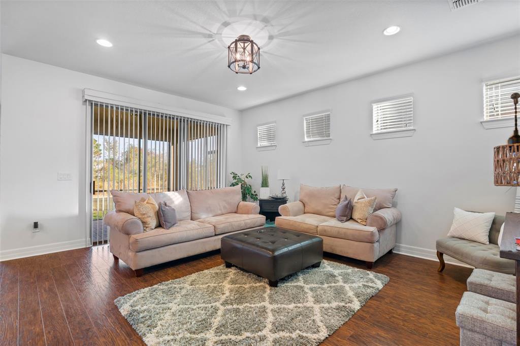 4730 111th Terrace East Parrish, FL 34219 - Photo 15 of 60 a living room with furniture and a large window