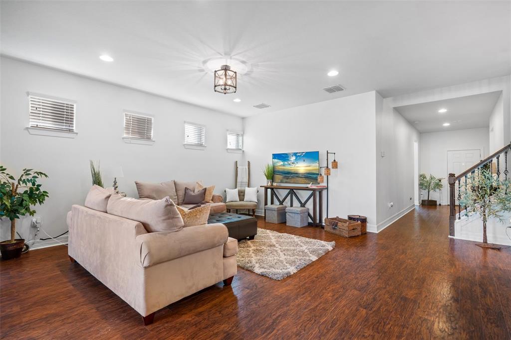 4730 111th Terrace East Parrish, FL 34219 - Photo 17 of 60 a living room with furniture and a wooden floor