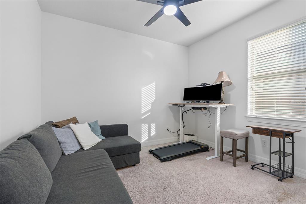 4730 111th Terrace East Parrish, FL 34219 - Photo 28 of 60 a living room with furniture and a flat screen tv