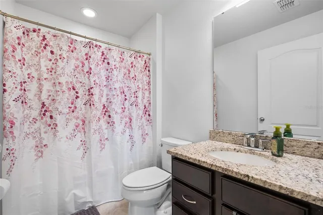 a view of road with card and trees