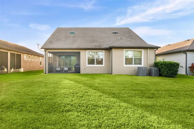 a living room with fireplace furniture and a wooden floor