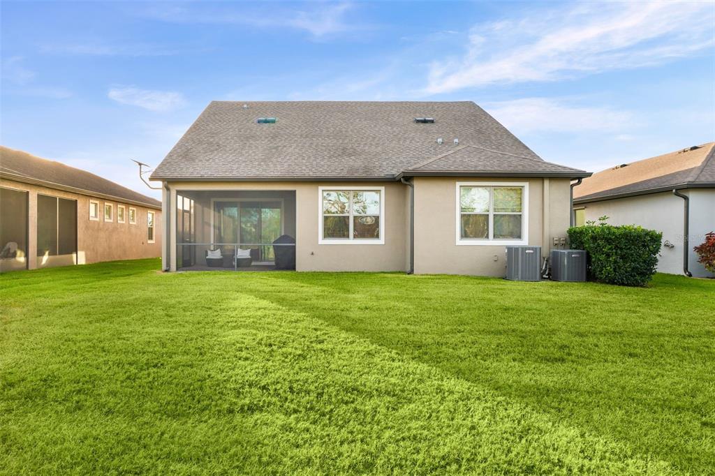 4730 111th Terrace East Parrish, FL 34219 - Photo 39 of 60 front view of a house with a garden