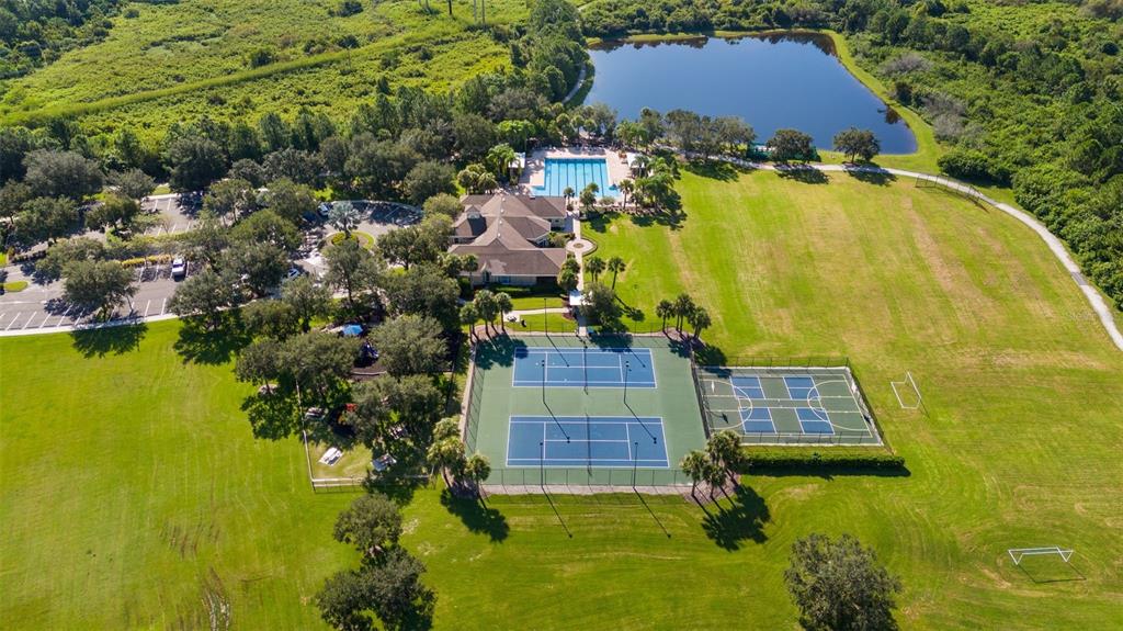 4730 111th Terrace East Parrish, FL 34219 - Photo 44 of 60 an aerial view of residential houses with swimming pool