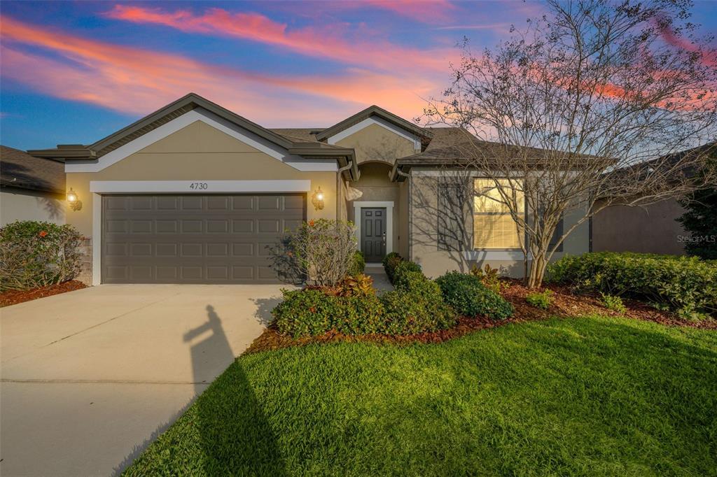 4730 111th Terrace East Parrish, FL 34219 - Photo 58 of 60 a front view of a house with garden