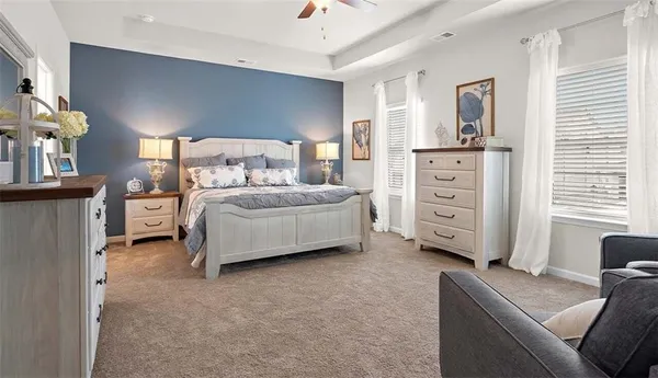 a bedroom with a bed and a cabinets