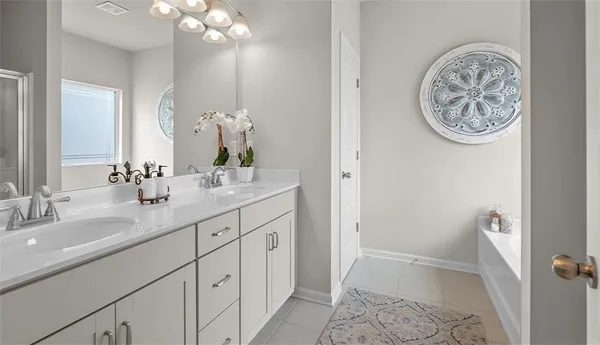 a bathroom with a sink a mirror and a toilet