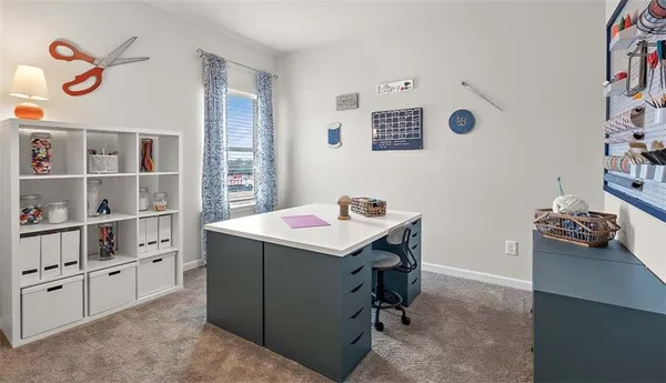 a room with a table and workspace