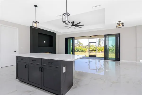 a view of a kitchen with a sink and a window