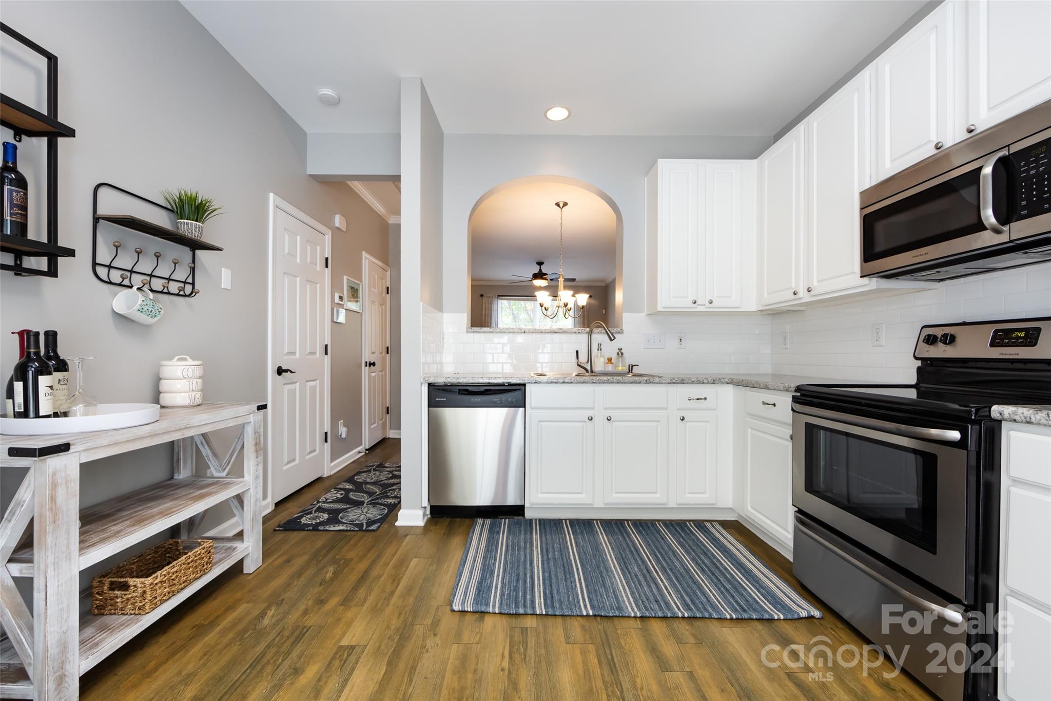726 Shellstone Place Fort Mill, SC 29708 - Photo 13 of 31 a kitchen with wooden floor and electronic appliances