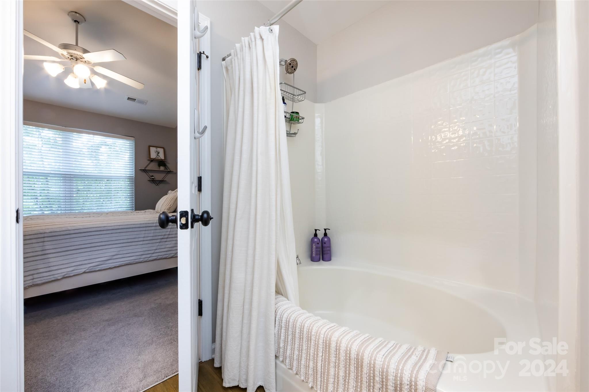 726 Shellstone Place Fort Mill, SC 29708 - Photo 24 of 31 a bathroom with a bathtub and a shower