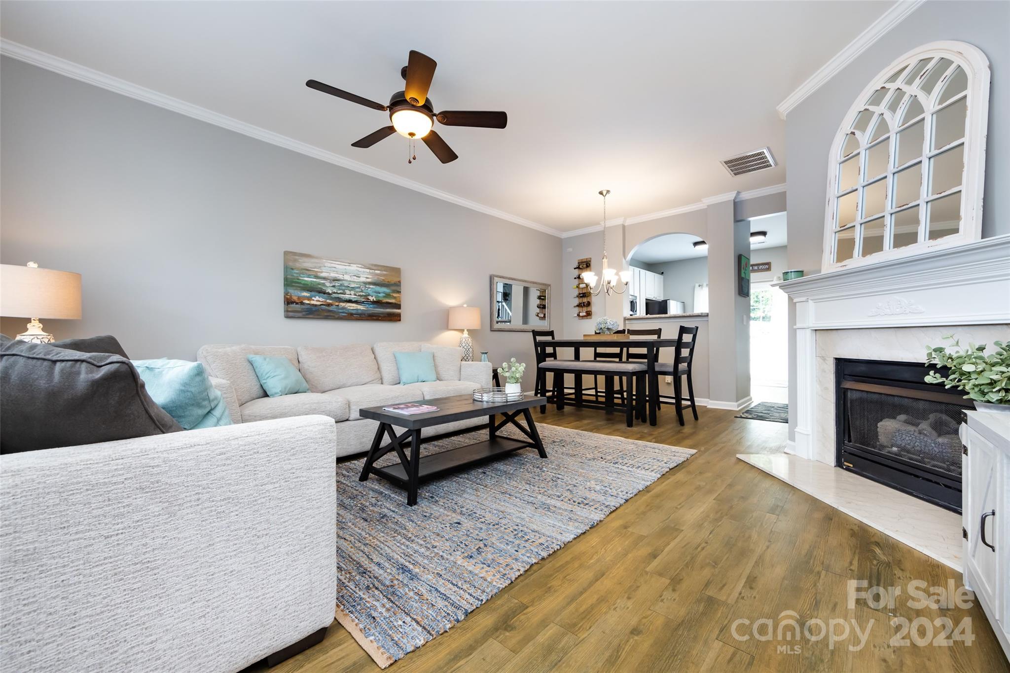 726 Shellstone Place Fort Mill, SC 29708 - Photo 3 of 31 a living room with furniture and a fireplace
