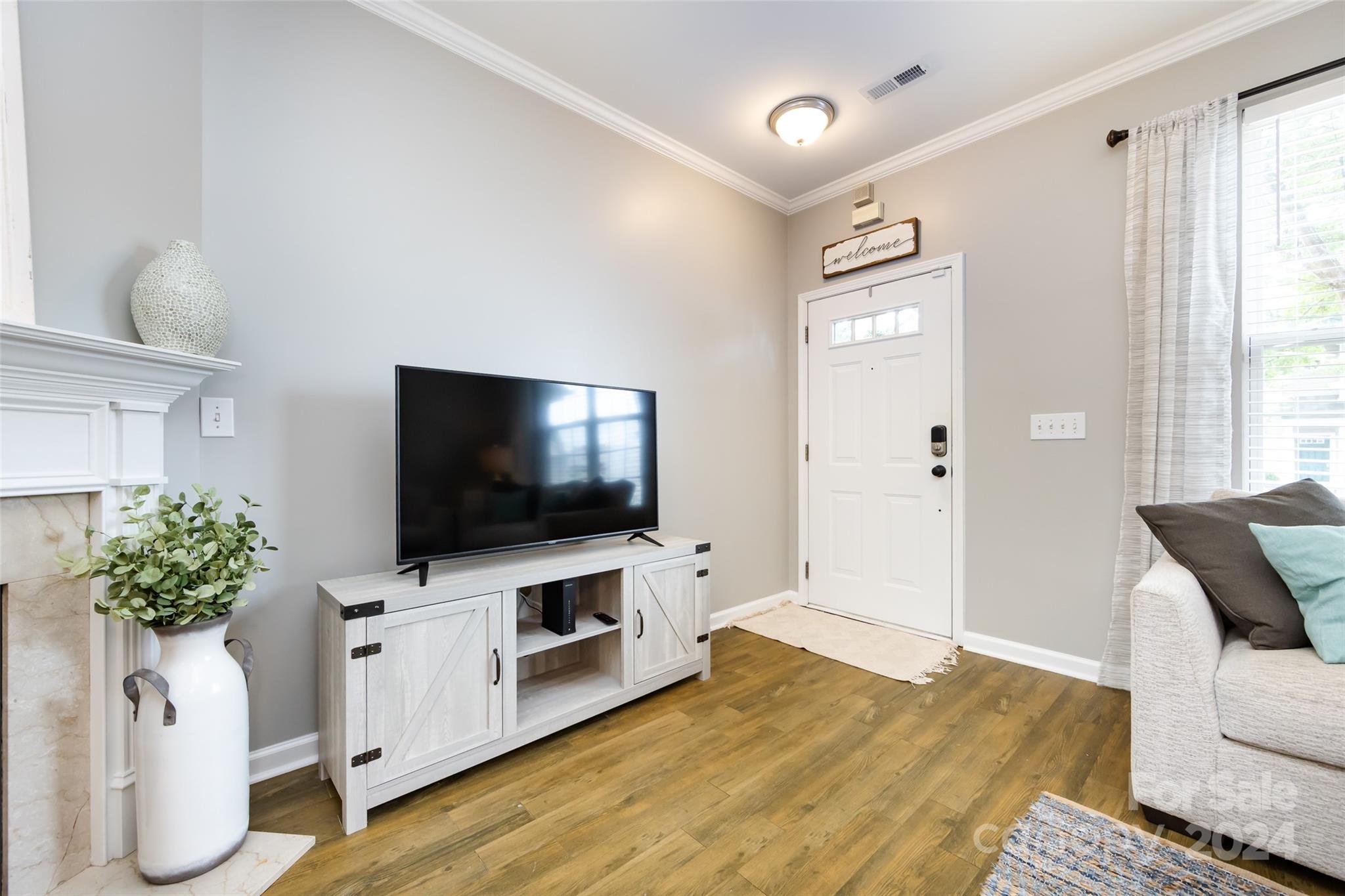 726 Shellstone Place Fort Mill, SC 29708 - Photo 7 of 31 a living room with furniture and a flat screen tv