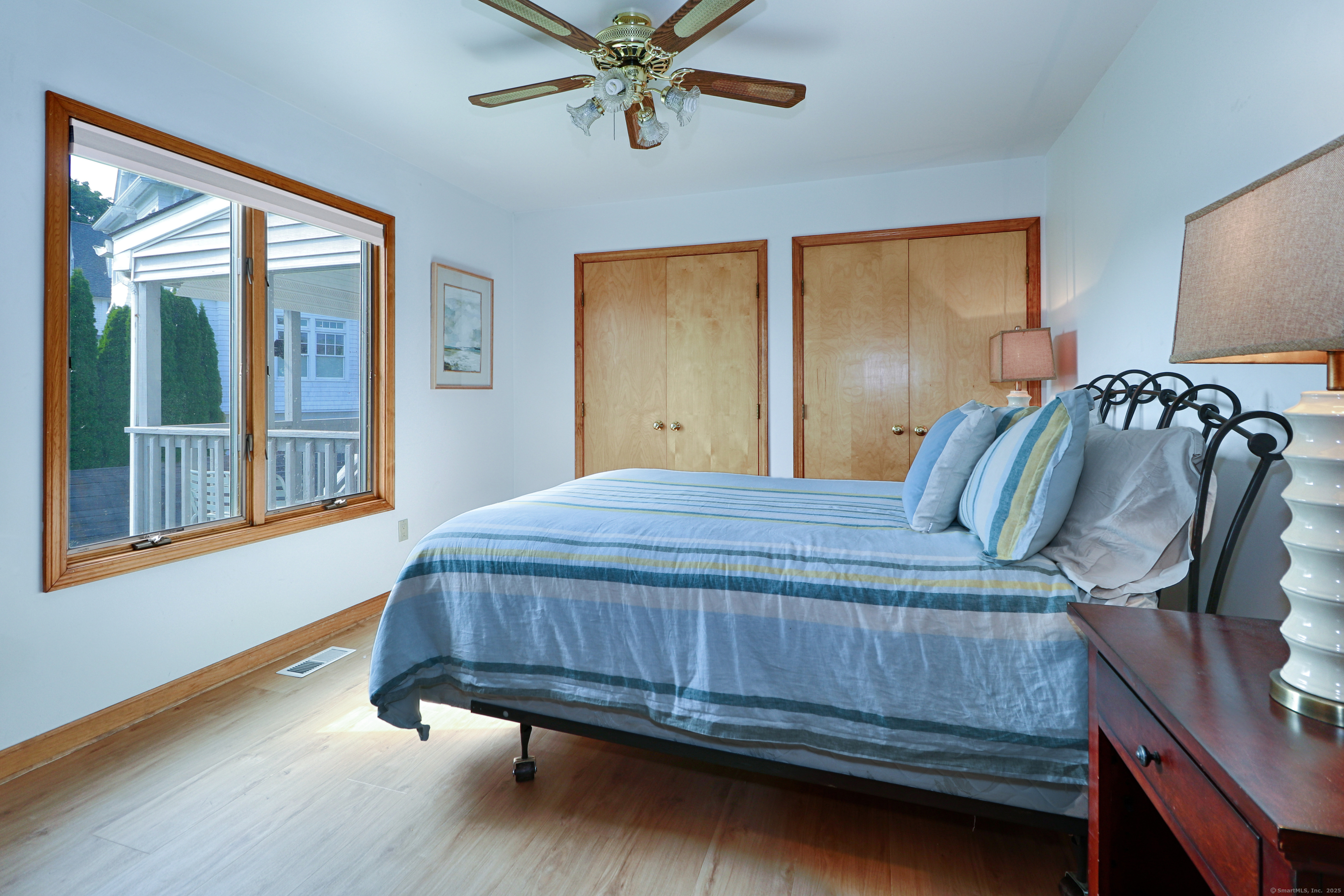 560 Fairfield Beach Road Fairfield, CT 06824 - Photo 12 of 38 a bedroom with a bed and window