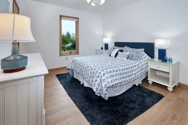 a bedroom with bed and window