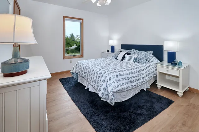 a bedroom with bed and window