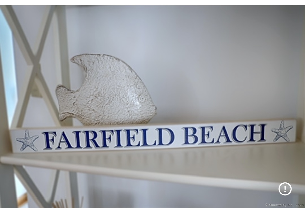 560 Fairfield Beach Road Fairfield, CT 06824 - Photo 2 of 38 a close up of a street sign