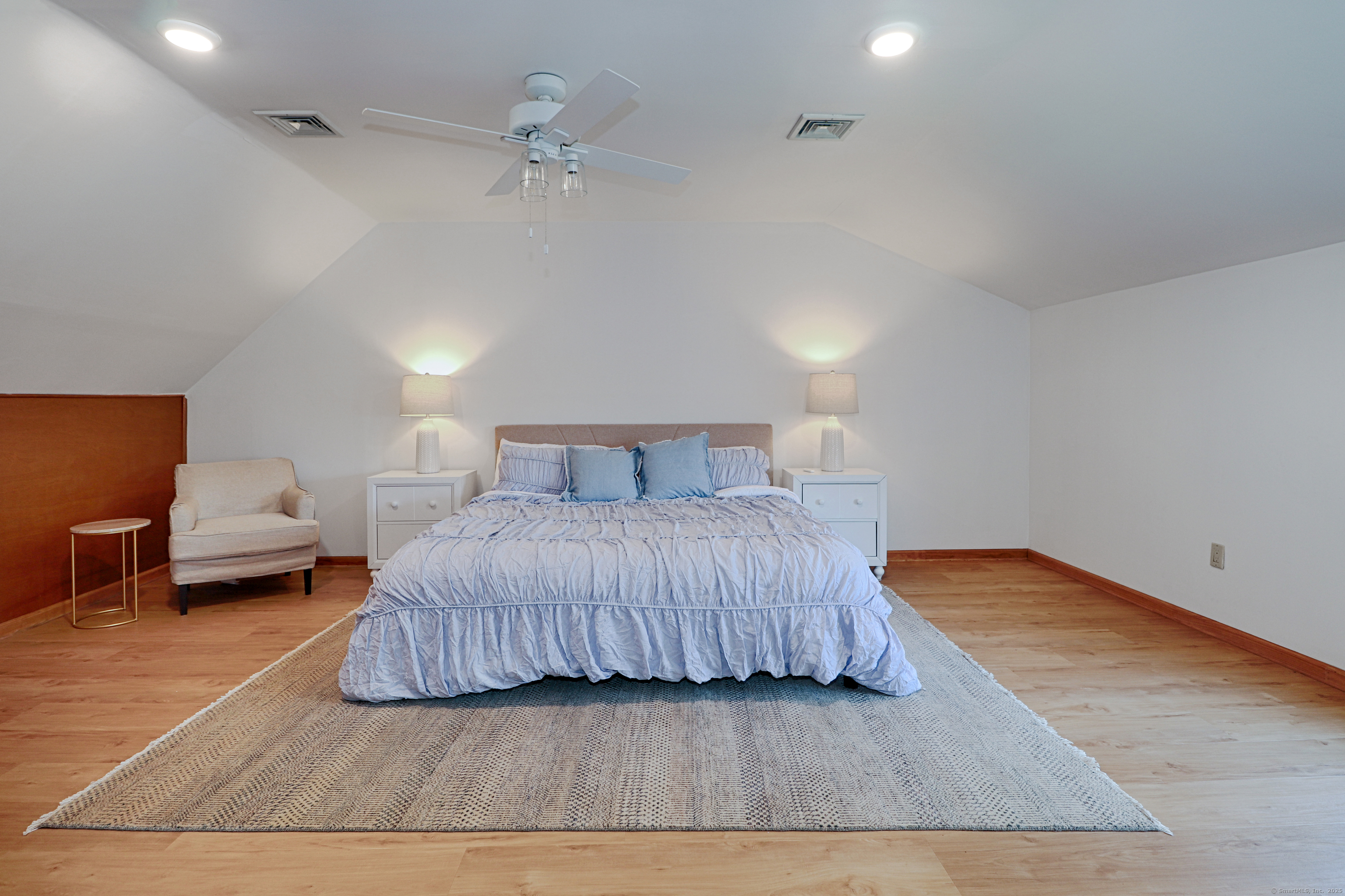 560 Fairfield Beach Road Fairfield, CT 06824 - Photo 22 of 38 a bedroom with a bed and a table