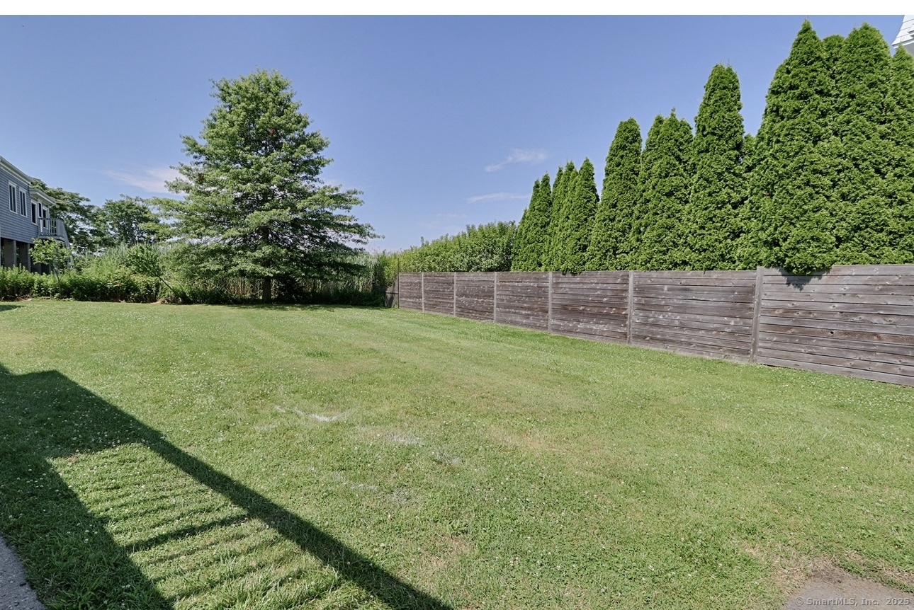 560 Fairfield Beach Road Fairfield, CT 06824 - Photo 37 of 38 a view of a backyard with a garden