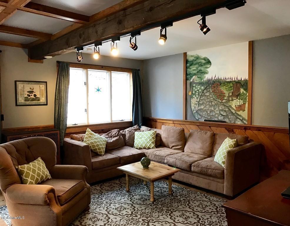47 Thompson Road Colrain, MA 01340 - Photo 2 of 17 a living room with furniture and a large window