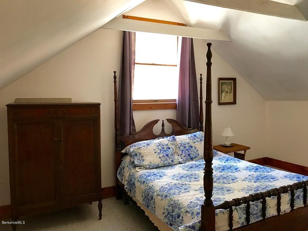 47 Thompson Road Colrain, MA 01340 - Photo 11 of 17 a living room with furniture and a window