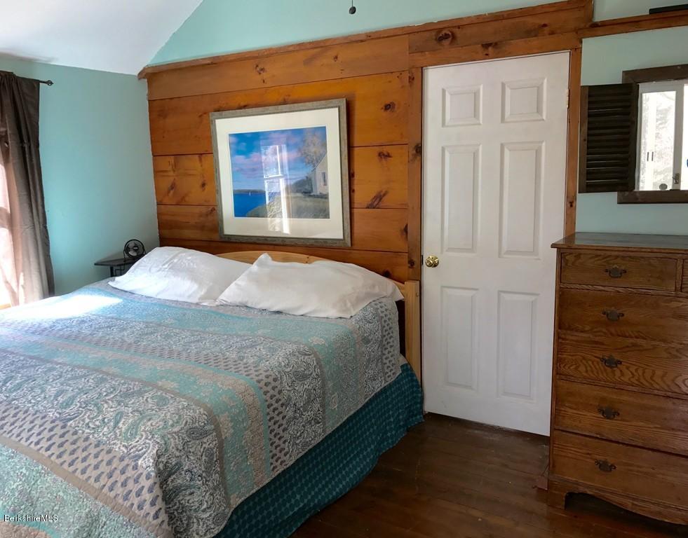 47 Thompson Road Colrain, MA 01340 - Photo 14 of 17 a bedroom with a bed and wooden floor