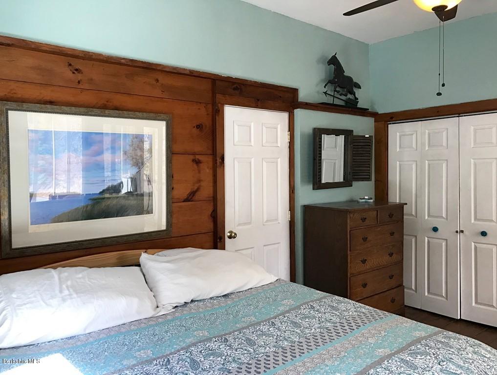 47 Thompson Road Colrain, MA 01340 - Photo 15 of 17 a bedroom with a bed and a dresser