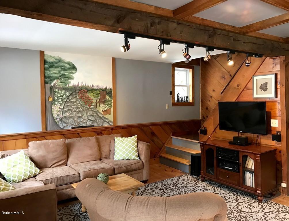 47 Thompson Road Colrain, MA 01340 - Photo 3 of 17 a living room with furniture and a flat screen tv