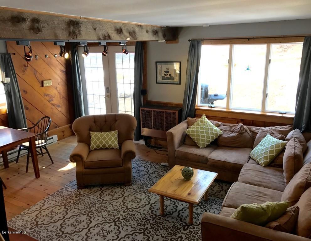 47 Thompson Road Colrain, MA 01340 - Photo 5 of 17 a living room with furniture and a large window