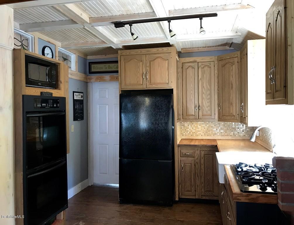 47 Thompson Road Colrain, MA 01340 - Photo 6 of 17 a kitchen with stainless steel appliances granite countertop a refrigerator and a stove
