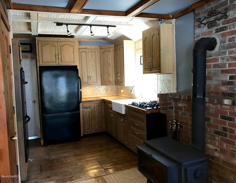 47 Thompson Road Colrain, MA 01340 - Photo 7 of 17 a kitchen with stainless steel appliances granite countertop a refrigerator and a stove