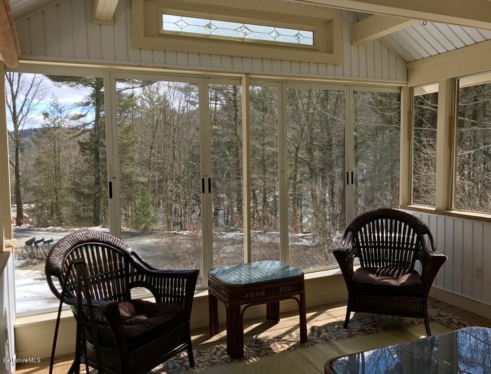 47 Thompson Road Colrain, MA 01340 - Photo 10 of 17 a view of a balcony with chair and table