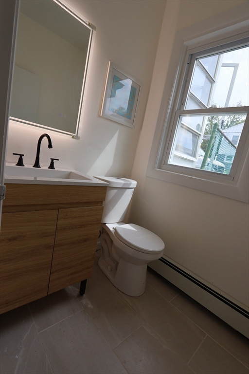 331 Proctor Avenue Revere, MA 02151 - Photo 12 of 29 a bathroom with a toilet sink and mirror