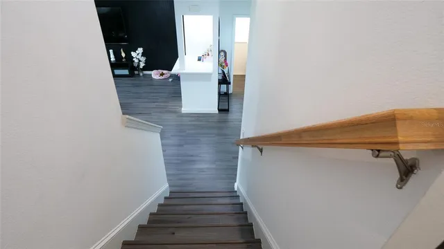 a bedroom with a bed and flat screen tv