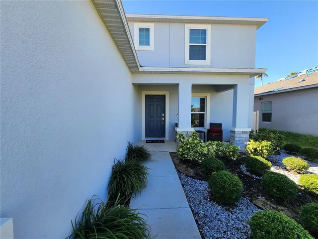 a view of a livingroom with furniture and a flat screen tv