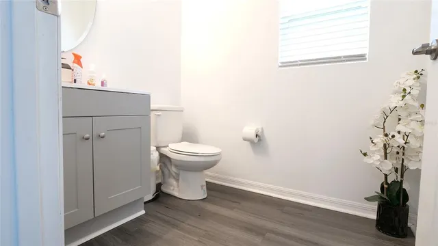 a bathroom with a toilet and a sink