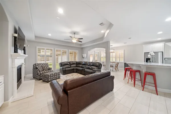a large spacious bathroom with a granite countertop tub sink shower and mirror