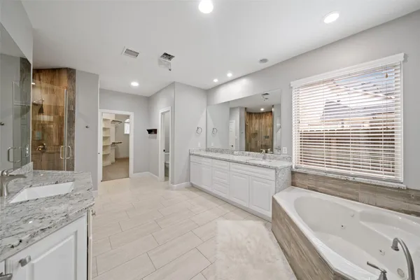 a bedroom with a bed and cabinet