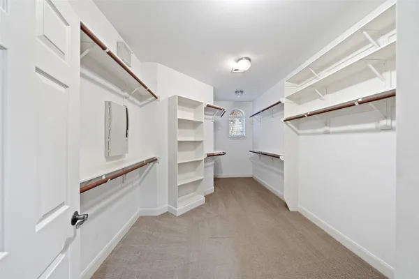 a bedroom with a bed and a cabinets