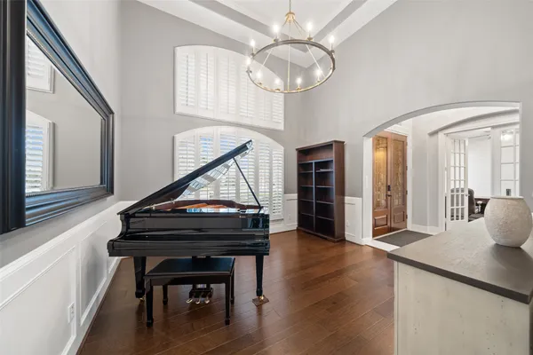 a view of kitchen with furniture and a chandelier