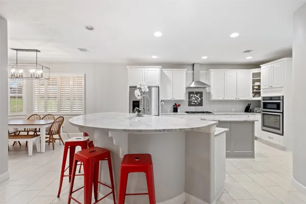a view of a dining room with furniture and window