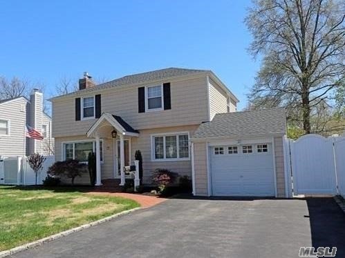 57 Crest Road East North Merrick, NY 11566 - Photo 1 of 1 a front view of a house with a yard
