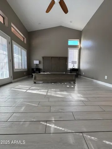 a view of a livingroom with a chair and a fireplace