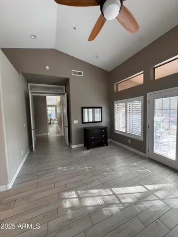 a view of an empty room with a window