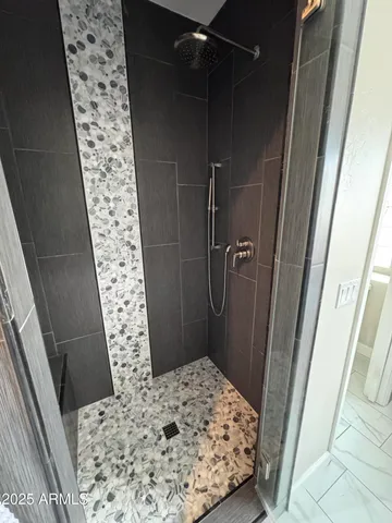 a bathroom with a sink and a shower