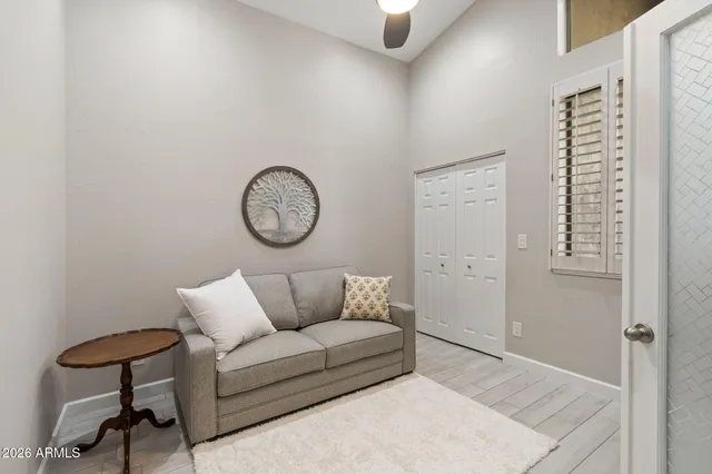 a bedroom with furniture and a window