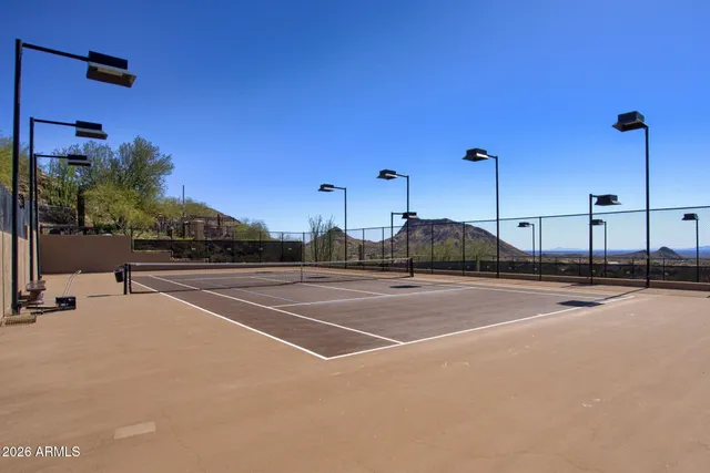 a kitchen with granite countertop a refrigerator and window