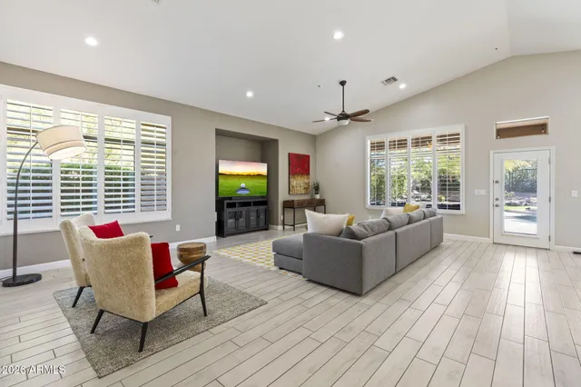 a living room with furniture and a table