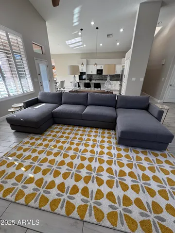 a living room with a black white checkered floor